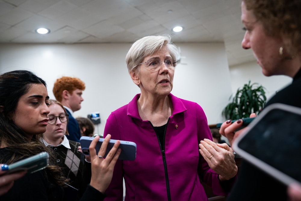 Elizabeth Warren speaking to reporters on Capitol Hill