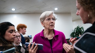 Elizabeth Warren speaking to reporters on Capitol Hill