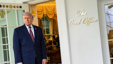 Donald Trump speaks to members of the media outside the Oval Office.