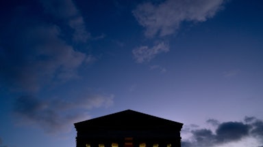 Clouds are seen in the sky above the US Supreme Court at dusk in Washington, DC