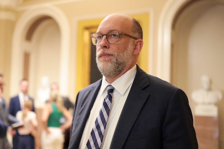 Office of Management and Budget Director Russell Vought walks in the Capitol