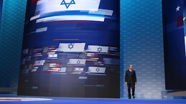 A large screen with the U.S. and Israeli flags intertwined.