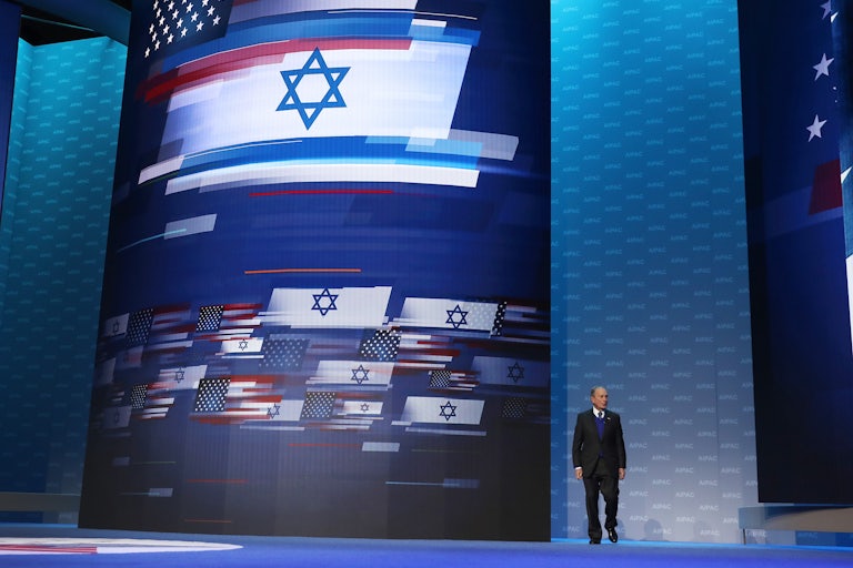 A large screen with the U.S. and Israeli flags intertwined.