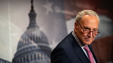 Chuck Schumer looks over his glasses