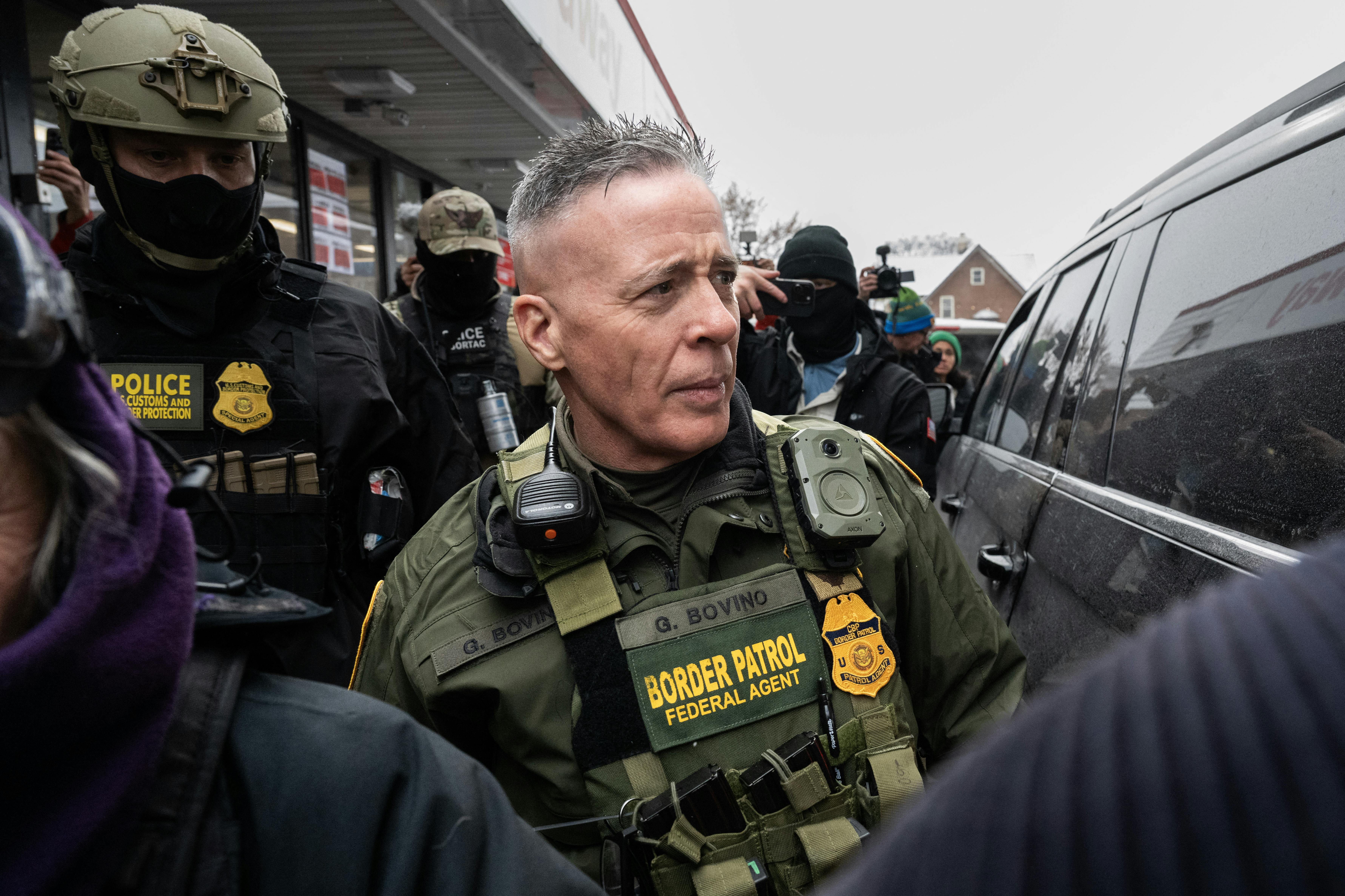 Border Patrol commander Gregory Bovino surrounded by agents