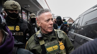 Border Patrol commander Gregory Bovino surrounded by agents