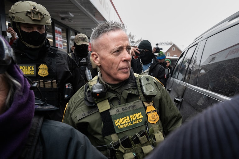 Border Patrol commander Gregory Bovino surrounded by agents
