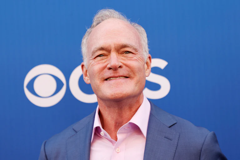 Scott Pelley smiles at an event