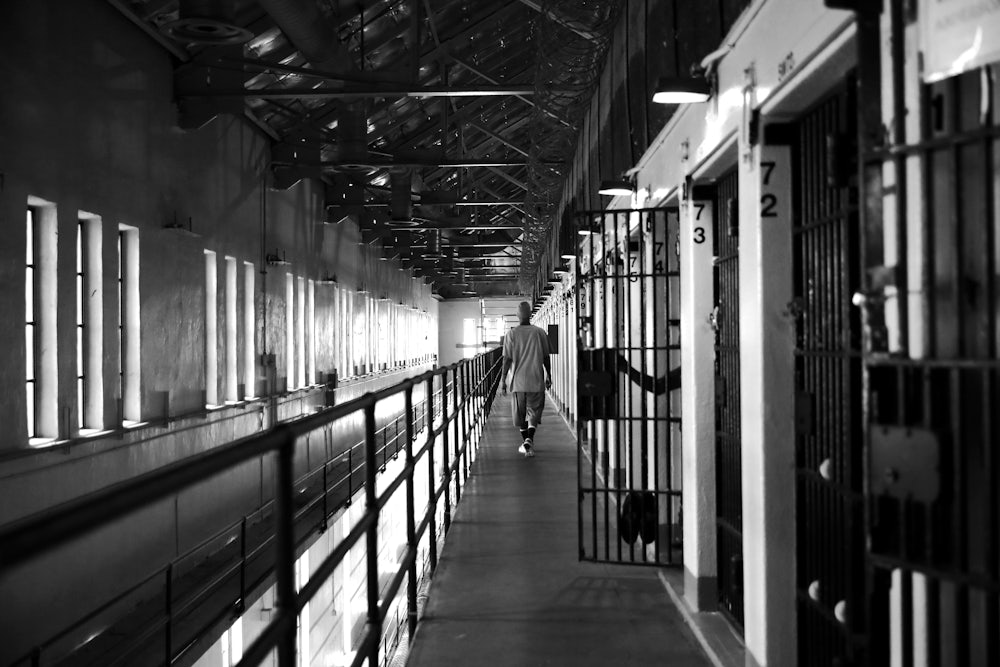 A man walks down the hallway near his cell at San Quentin Prison in California.