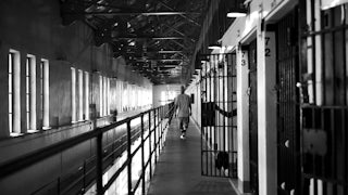 A man walks down the hallway near his cell at San Quentin Prison in California.