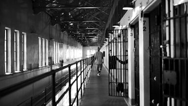 A man walks down the hallway near his cell at San Quentin Prison in California.