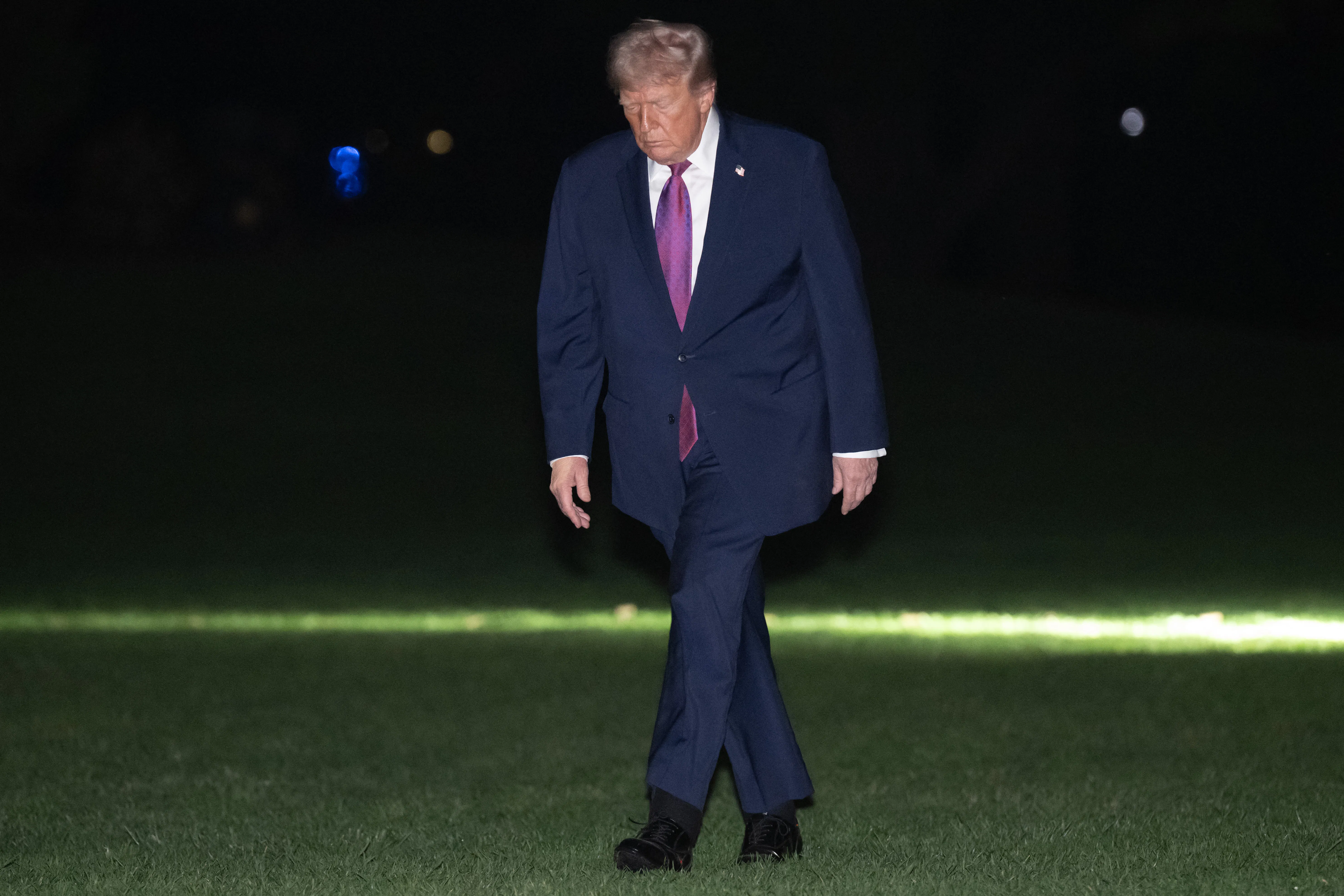 Donald Trump walking on the South Lawn of the White House