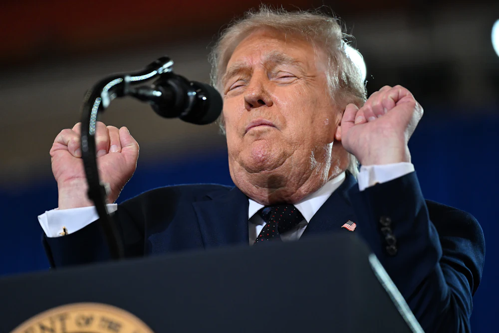 Donald Trump leans back with closed eyes and clenched fists while speaking at an event