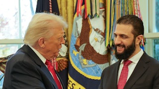 Donald Trump speaks to Syrian President Ahmed al-Sharaa at the White House.