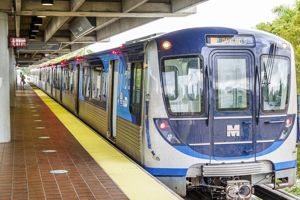 A train pulls up to a platform.