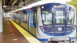 A train pulls up to a platform.
