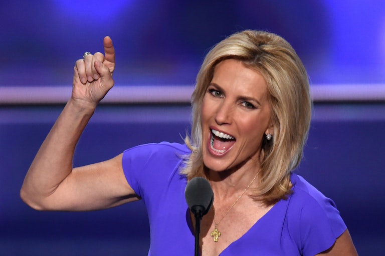 Fox News’s Laura Ingraham smiles as she gesticulates to the crowd.