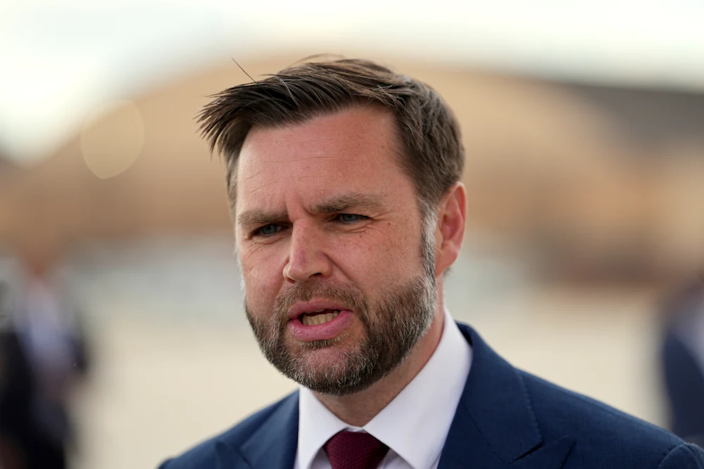JD Vance stares, looking a bit puzzled