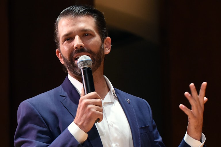 Donald Trump Jr. speaks into a handheld mic