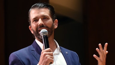 Donald Trump Jr. speaks into a handheld mic