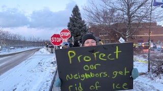 A person holds a sign that says, "Protect our neighbors, get rid of ICE"
