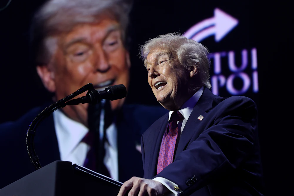 Donald Trump speaks at a rally for Turning Point USA, an organization on the vanguard of the far-right “biblical economics” movement.