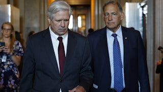 Senators John Hoeven (left) and John Boozman walking through the Capitol