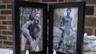 Photos of Alex Pretti and electric candles sit outside his house