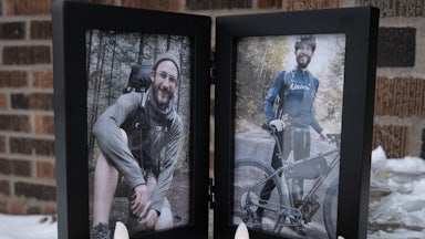Photos of Alex Pretti and electric candles sit outside his house
