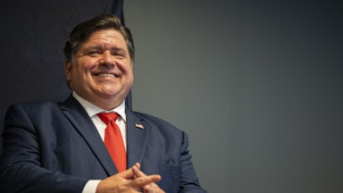 Illinois Governor J.B. Pritzker smiles during a 2024 United States Democratic National Convention security briefing.