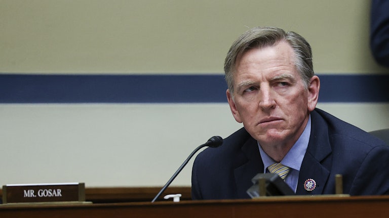 A close up of a scowling Paul Gosar.