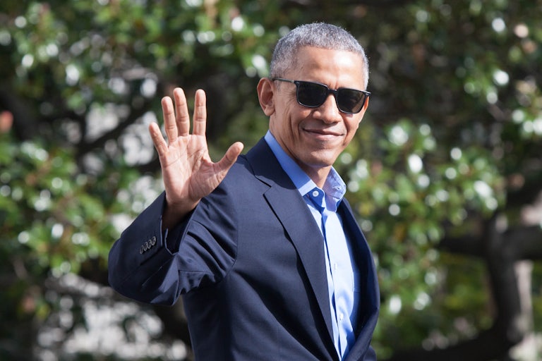 Former President Barack Obama waves.