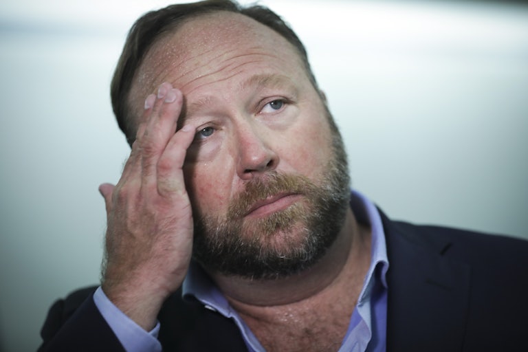 Alex Jones wipes his forehead
