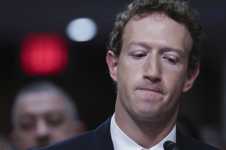 Mark Zuckerberg looks down