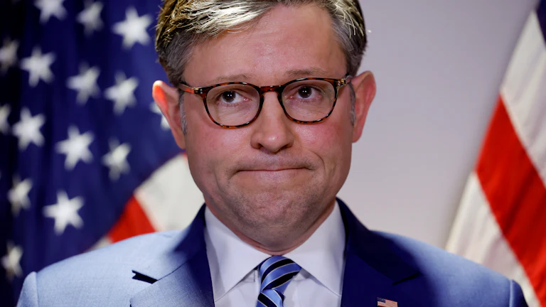 Speaker of the House Mike Johnson frowns.