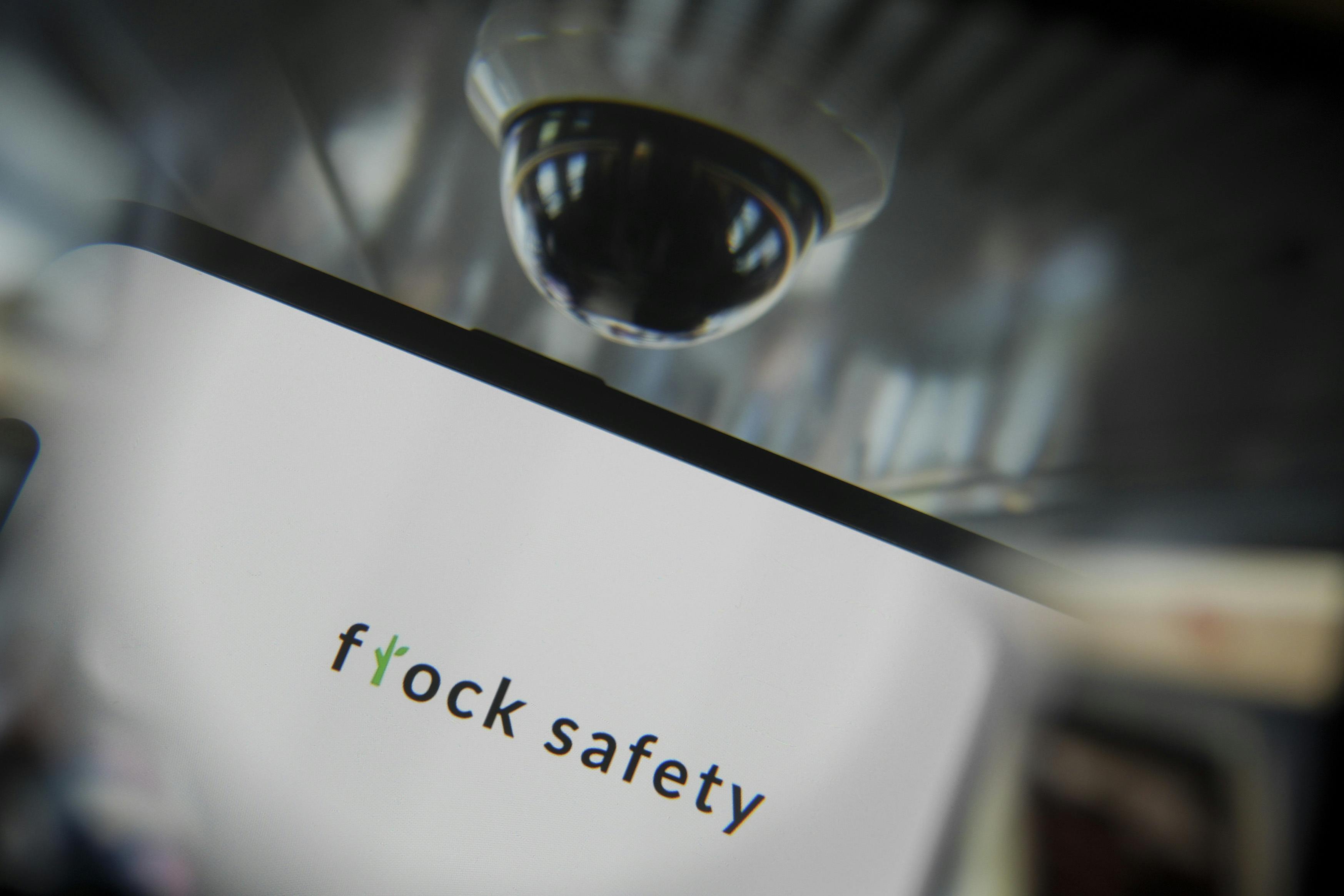 In this photo illustration, Flock Safety logo is being displayed on a mobile phone screen.