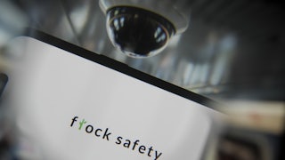 In this photo illustration, Flock Safety logo is being displayed on a mobile phone screen.