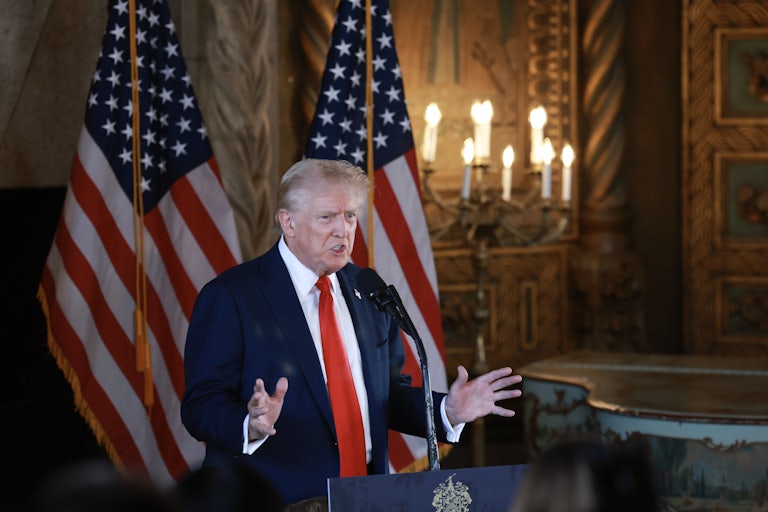Donald Trump speaks at a lectern at Mar-a-Lago
