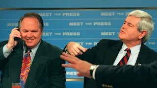 Radio talk show host Rush Limbaugh talks on a phone as House Speaker Newt Gingrich gestures during a break in taping of NBC’s “Meet the Press”