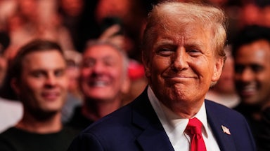 Donald Trump does that goofy toothless grin he does.