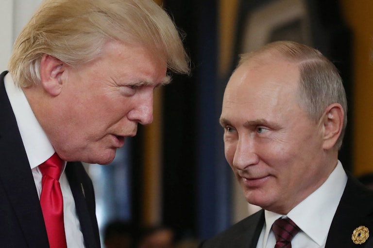 Vladimir Putin grins knowingly at Donald Trump