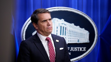 Deputy Attorney General Todd Blanche stands during a press briefing