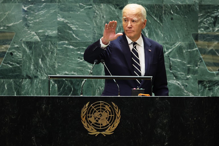 Joe Biden waves at the United Nations podium