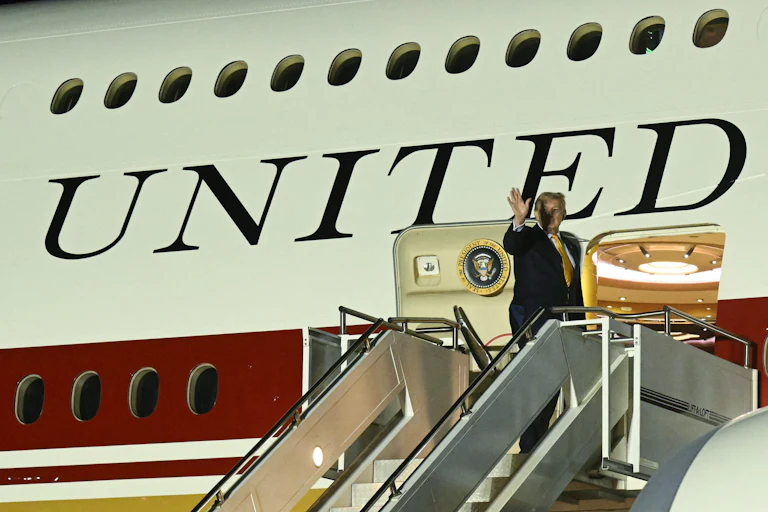 President Trump waves while boarding the new Air Force One on July 8.