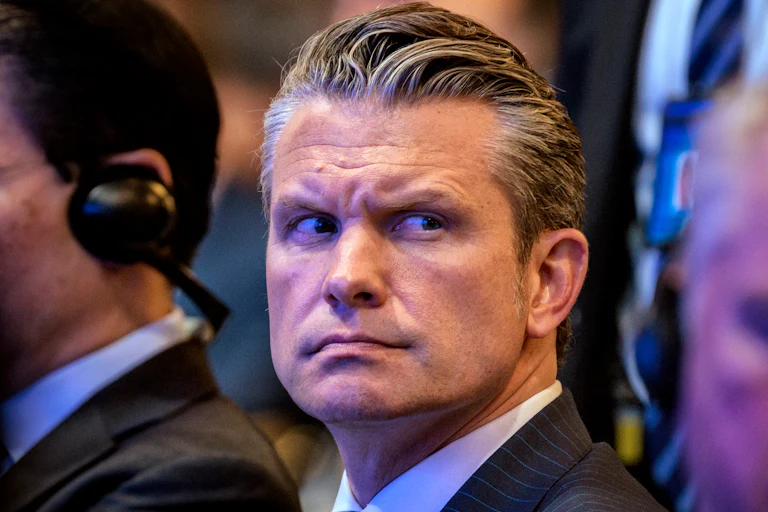 Pete Hegseth looks to the side.