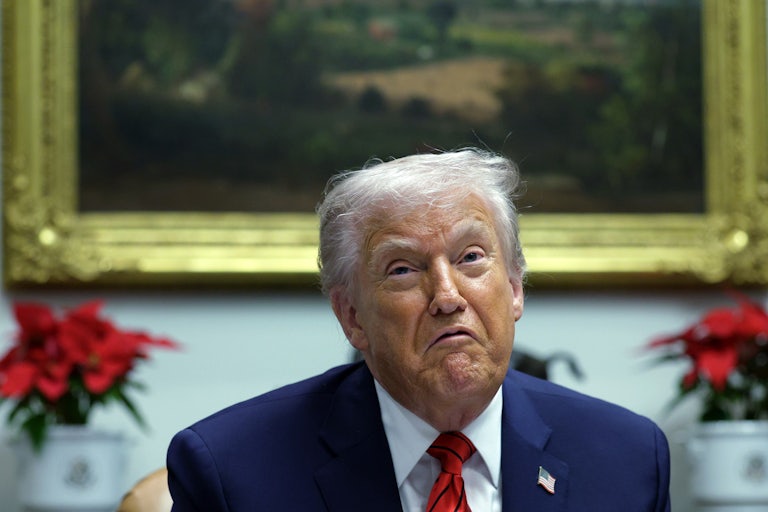 Donald Trump pulls the corners of his mouth down while speaking