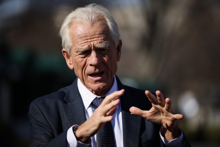 Trump adviser Peter Navarro speaks with his hands outside