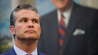 Defense Secretary Pete Hegseth stands in front of a White House portrait.