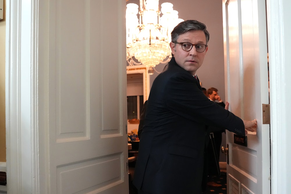 Speaker of the House Mike Johnson arrives to a House Rules Committee meeting on the One Big Beautiful Bill Act at the U.S. Capitol on May 21, 2025.