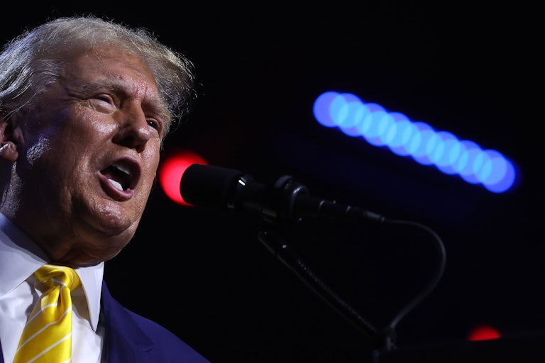 Donald Trump yelling into a mic